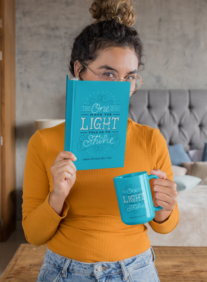 teal prayer journal and coffee mug